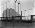 Photograph: [Photograph of a bridge and a grain elevator]