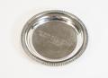 Photograph: [Silver ashtray with an inscription]