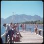 Photograph: [A group of people on a pier over Lake Villarrica in Pucón]