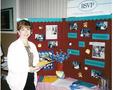 Photograph: [Woman at 1998 Amarillo health fair SVCI booth]
