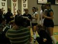 Photograph: [Cassie Headrick speaks to UNT volleyball players during 2006 Sun Bel…
