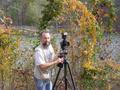Primary view of [Randy Mallory adjusts tripod at Tyler State Park, 2]