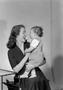 Photograph: [Larry Osborn being held by his mother Mrs. Osborn]