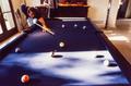 Primary view of [Mike Modano playing pool with a family member]