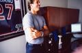 Photograph: [Mike Modano standing in his office]