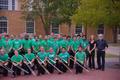 Photograph: [Trombone students and trombone faculty posing in front of a building…