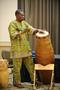 Photograph: [Giddeon Alorwoyie playing a tall drum, 1]