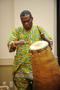 Photograph: [Giddeon Alorwoyie playing a tall drum, 2]