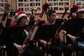 Primary view of [Two rows of people playing bassoons adorned with tinsel, 4]