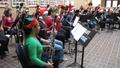 Primary view of [Two rows of people playing bassoons adorned with tinsel, 7]