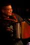 Primary view of [Accordion player performing at festival]