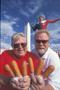 Photograph: [Corn Dog Delights at the State Fair: Posing with Big Tex and Tower B…