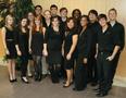 Photograph: [Three rows of jazz singers dressed in black, posing]