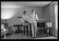 Photograph: [Two Boys Playing Instruments at Home]