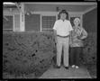 Photograph: [Older couple posed on a porch]
