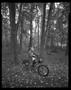 Photograph: [Kid on Bike in Woods, 2000]