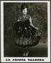 Photograph: [La Prieta Caldera holding a hat and her skirt]