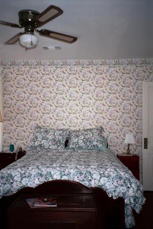 Primary view of object titled '[A bedroom at the Redbud Inn, 2]'.
