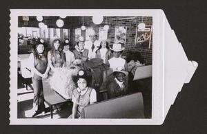 Primary view of object titled '[Group of people in a Dairy Queen]'.