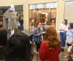 Photograph: [Artifact donor Linda Anderson speaking about a faux fur cape]