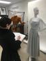 Primary view of [Costume design student sketching garments]