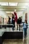 Photograph: [Annette Becker lifting a mannequin]