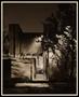 Photograph: [Rectangular brick building at night]
