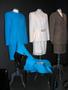 Photograph: [Three skirt-suits on display]