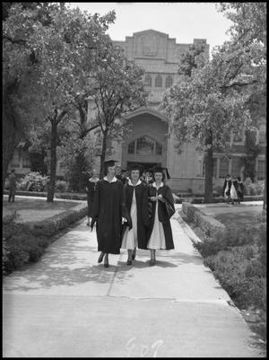 Primary view of object titled '[Commencement - Auditorium - Three Graduates - 1950]'.