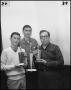 Photograph: [Three men pose with trophies]