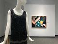 Primary view of [A 1920s beaded dress in front of a Nancy Lamb painting]