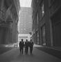 Primary view of [Three suited men on a dark street, 2]