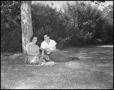 Primary view of [Two Students Sitting Under a Tree]