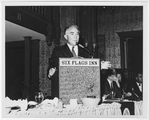 Primary view of object titled '[Rex Cauble speaking at Six Flags Inn]'.