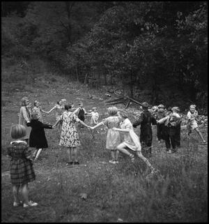 Primary view of object titled '[Children playing "drop the handkerchief"]'.