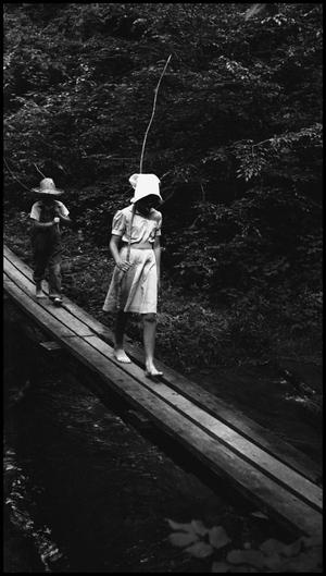 Primary view of object titled '[Children crossing a bridge]'.