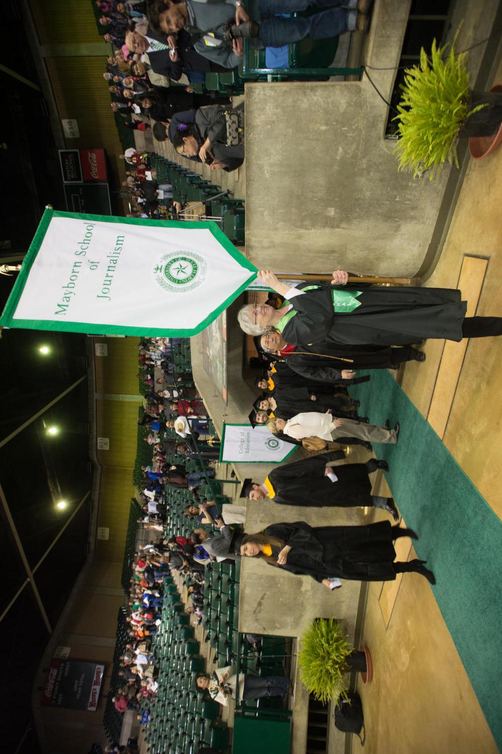 [Graduates entering Coliseum during UNT Fall Commencement]
                                                
                                                    [Sequence #]: 1 of 1
                                                