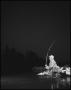 Photograph: [A man fishing at night, 3]