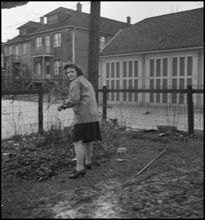 Primary view of object titled '[Woman carrying a bundle of sticks]'.