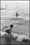 Photograph: [Young boy playing in the water]