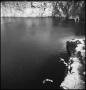 Photograph: [Three young men cliff diving]