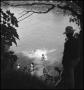 Photograph: [Photograph of a man watching people go swimming, 1]