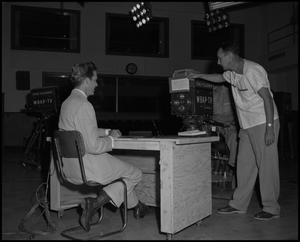 Primary view of object titled '[Frank Mills and Jimmy Turner working at WBAP-TV]'.