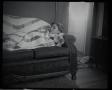 Primary view of [Carol Williams laying on a couch, 3]