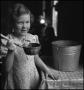 Photograph: [Young girl with ladle]