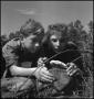 Photograph: [Harry England and Otto Walker catching a lizard]