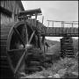 Photograph: [Water cascading from a mill wheel, 3]
