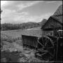 Photograph: [Watermill overlooking a field, 4]