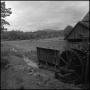 Photograph: [Watermill overlooking a field, 5]