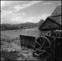 Photograph: [Watermill overlooking a field, 6]